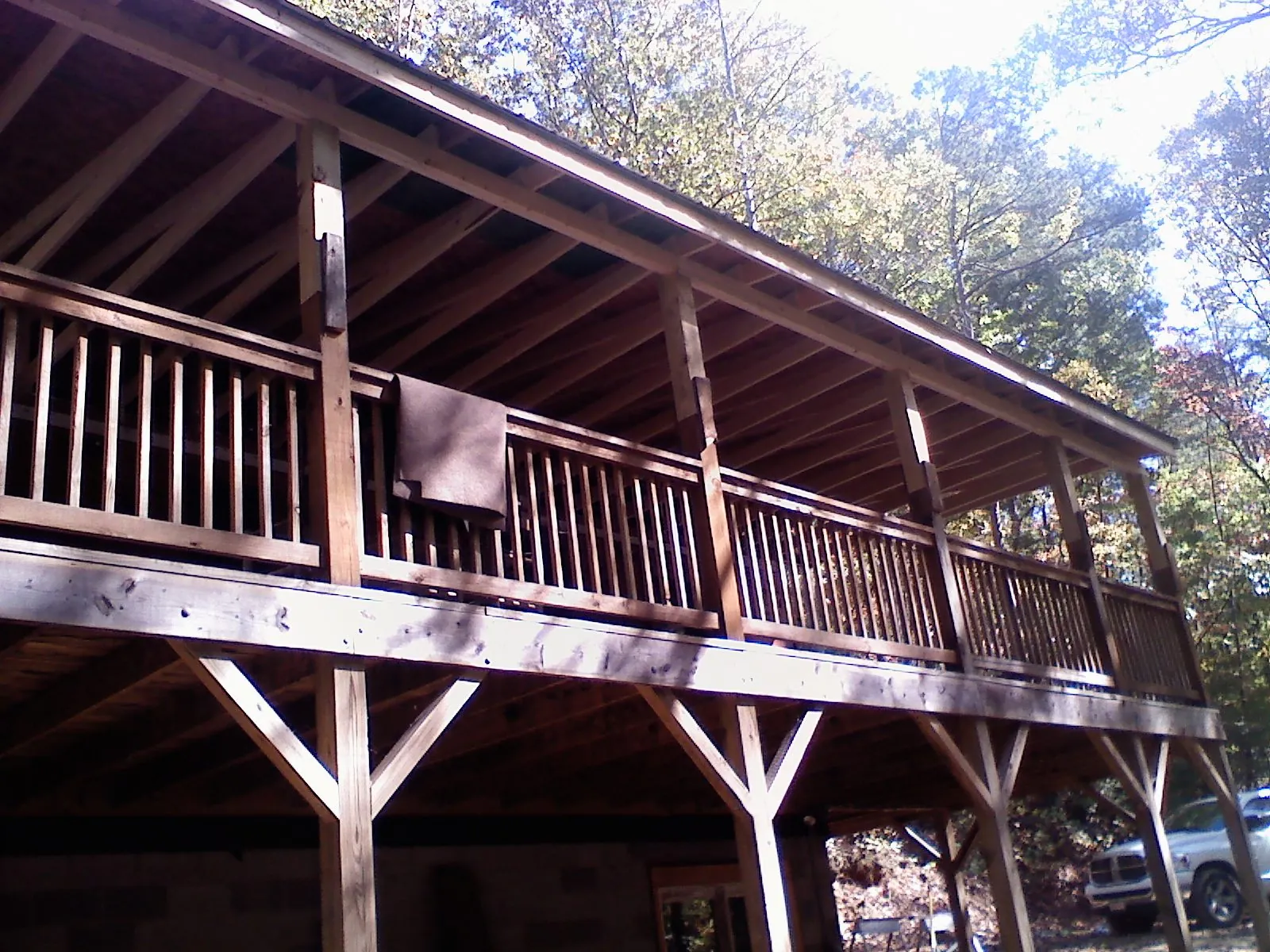 Timber framing under a new elevated porch and deck — Roof Leak Repair in Great Barrington by Roofing Brothers